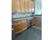 Modern kitchen with stainless steel appliances and wood cabinets at 11420 Captiva Kay Dr, Riverview, FL 33569