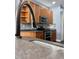 Modern kitchen with stainless steel appliances and wood cabinets at 11420 Captiva Kay Dr, Riverview, FL 33569
