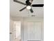 Bedroom with ceiling fan and double door closet at 3875 Pan American Blvd, North Port, FL 34287