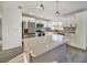 Modern kitchen with white cabinets, large island, and stainless steel appliances at 3875 Pan American Blvd, North Port, FL 34287