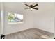 Bright bedroom with ceiling fan and vinyl plank flooring at 3875 Pan American Blvd, North Port, FL 34287