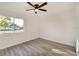Bright bedroom with ceiling fan and view of the street at 3875 Pan American Blvd, North Port, FL 34287