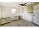 Home office with built-in desk and cabinets, ceiling fan at 3875 Pan American Blvd, North Port, FL 34287