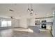 Modern kitchen with island, stainless steel appliances, and white cabinets at 3875 Pan American Blvd, North Port, FL 34287
