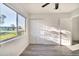 Bedroom with large window, closet and ceiling fan at 3875 Pan American Blvd, North Port, FL 34287