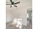 Bright bedroom with ceiling fan and vinyl plank flooring at 3875 Pan American Blvd, North Port, FL 34287