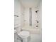 Updated bathroom with tub, shower, and pebble tile accents at 3875 Pan American Blvd, North Port, FL 34287