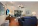 Comfortable living room with hardwood floors, a sofa, and a TV at 1801 Gulf N Dr # 248, Bradenton Beach, FL 34217