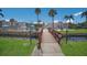 Wooden footbridge leads to community pool and amenities at 1801 Gulf N Dr # 248, Bradenton Beach, FL 34217