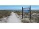 Beach access path leading to the sandy shore at 1801 Gulf N Dr # 248, Bradenton Beach, FL 34217