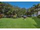 Green backyard with grill and picnic table at 1801 Gulf N Dr # 248, Bradenton Beach, FL 34217