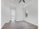 Main bedroom with gray floors and bathroom access at 200 Redwood Rd, Rotonda West, FL 33947