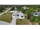 Aerial view of a single-Gathering home with a paver driveway at 200 Redwood Rd, Rotonda West, FL 33947