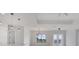 Modern kitchen with white cabinets and an island at 200 Redwood Rd, Rotonda West, FL 33947