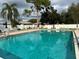 Inviting community swimming pool with lounge chairs at 6201 Green View Dr # 130, Sarasota, FL 34231