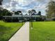 Community clubhouse with walkway and landscaping at 6201 Green View Dr # 130, Sarasota, FL 34231