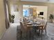 Elegant dining room with a long table and modern chairs at 6201 Green View Dr # 130, Sarasota, FL 34231