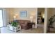 Comfortable living room with couch and view to bedroom at 6201 Green View Dr # 130, Sarasota, FL 34231