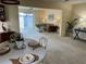 Bright dining room with table, chairs, and view into living room at 6201 Green View Dr # 130, Sarasota, FL 34231