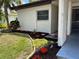 Landscaped area with red and yellow flowers at 6201 Green View Dr # 130, Sarasota, FL 34231