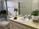 Bathroom with a tub, sink and decorative accents at 6201 Green View Dr # 130, Sarasota, FL 34231