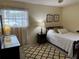Bedroom with a double bed, dresser and patterned rug at 6201 Green View Dr # 130, Sarasota, FL 34231