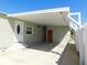 Attached carport with covered entry to the home at 1532 46Th Avenue E Dr, Ellenton, FL 34222