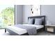 Bright bedroom with a queen-size bed and large window at 2170 Robinhood Street # C1-312, Sarasota, FL 34231