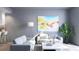 Bright living room with comfy sofas and large artwork at 2170 Robinhood Street # C1-312, Sarasota, FL 34231