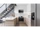 Modern kitchen with marble countertops and stainless steel appliances at 2170 Robinhood Street # C1-312, Sarasota, FL 34231