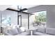 Spacious living area with large windows and patio view at 2170 Robinhood Street # C1-312, Sarasota, FL 34231