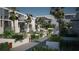 Complex exterior showing building and lush landscaping at 2170 Robinhood Street # C1-312, Sarasota, FL 34231