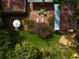 Brick patio with seating area, lush greenery, and a pergola at 1713 North Dr, Sarasota, FL 34239