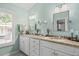 Bright bathroom with double vanity and granite countertop at 1713 North Dr, Sarasota, FL 34239