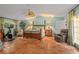 Spacious bedroom with tiled floors, a king-size bed, and a ceiling fan at 1713 North Dr, Sarasota, FL 34239