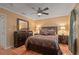 Comfortable bedroom with a queen-size bed and terracotta tile floors at 1713 North Dr, Sarasota, FL 34239