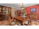 Elegant dining room features a large wood table, matching chairs, and built-in hutch at 1713 North Dr, Sarasota, FL 34239