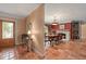 Elegant dining room with fireplace and terracotta tile floors at 1713 North Dr, Sarasota, FL 34239