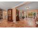 Bright and airy entrance hall with terracotta tile floors and views to other rooms at 1713 North Dr, Sarasota, FL 34239