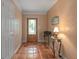 Bright entryway with terracotta tile floors and glass door at 1713 North Dr, Sarasota, FL 34239