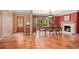 Spacious entryway with terracotta tile floors, fireplace, and view to dining area at 1713 North Dr, Sarasota, FL 34239