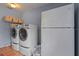 Convenient laundry room with washer, dryer, and refrigerator at 1713 North Dr, Sarasota, FL 34239