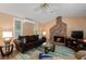 Cozy living room featuring a brick fireplace and comfortable seating at 1713 North Dr, Sarasota, FL 34239