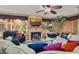 Relaxing living room with sectional sofa, fireplace, and view of the backyard at 1713 North Dr, Sarasota, FL 34239
