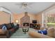 Bright living room with fireplace, comfortable seating and large windows at 1713 North Dr, Sarasota, FL 34239