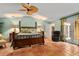 Spacious main bedroom with bamboo bed frame and access to backyard at 1713 North Dr, Sarasota, FL 34239