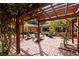 Brick patio with pergola, fire pit, and comfortable seating at 1713 North Dr, Sarasota, FL 34239