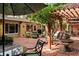 Brick patio with pergola, fountain, and seating area at 1713 North Dr, Sarasota, FL 34239