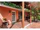 Inviting brick patio with seating area, lush landscaping, and pergola at 1713 North Dr, Sarasota, FL 34239