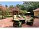 Brick patio with fire pit and comfortable seating at 1713 North Dr, Sarasota, FL 34239